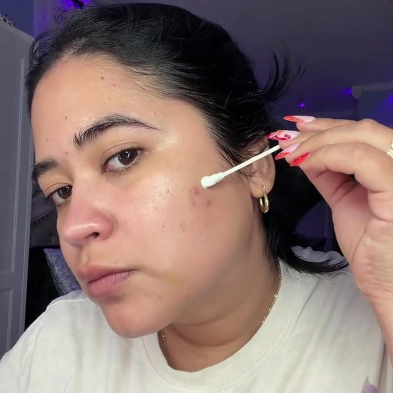 Cotton-swab spot application shown in supplied product footage